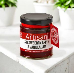 The artisan kitchen Strawberry apple vanilla jam on a white concrete countertop