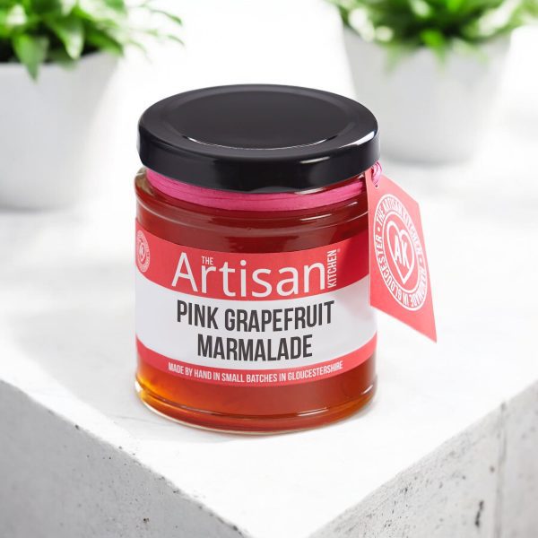 The artisan kitchen Pink grapefruit marmalade on a white concrete countertop